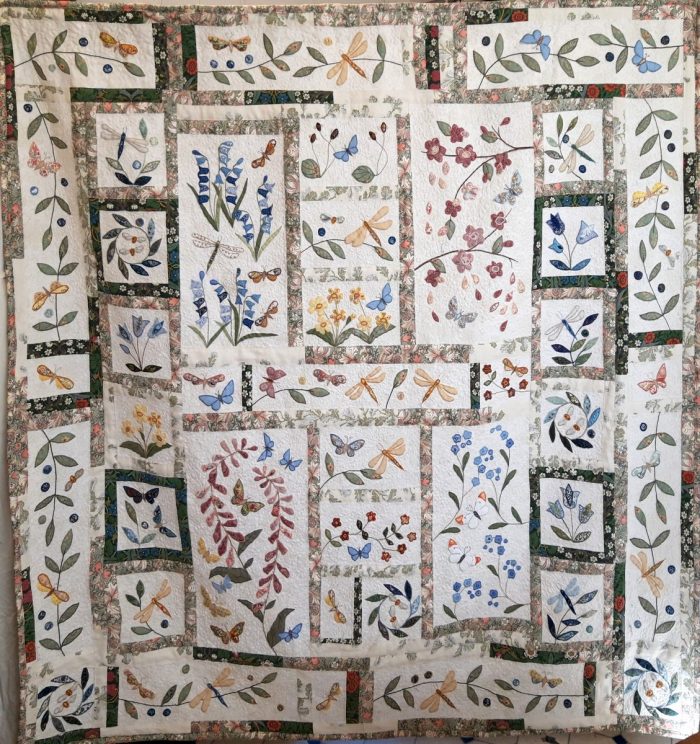 Floral Block quilt in pale greens, blues and pinks
