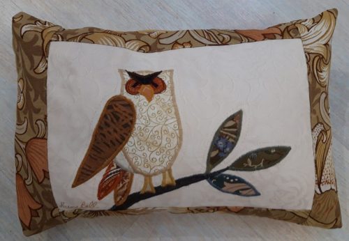 Owl on a branch facing right cushion. Vintage Morris Golden Lily border, smooth ochre back.