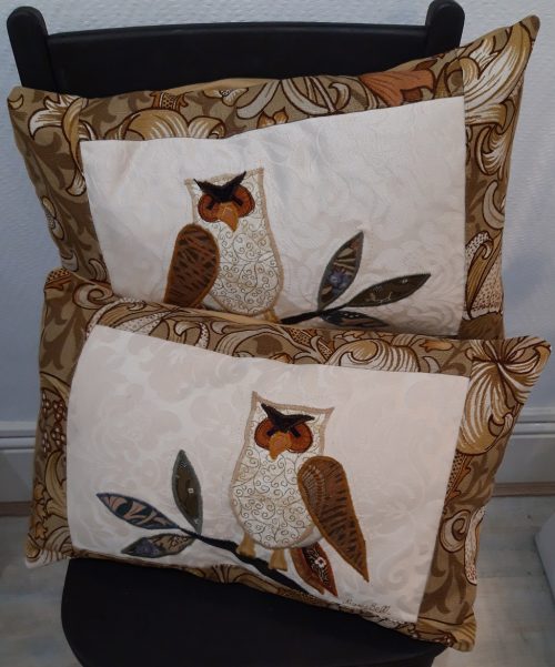 Owls on branches cushions. Vintage Morris Golden Lily border, smooth ochre back.