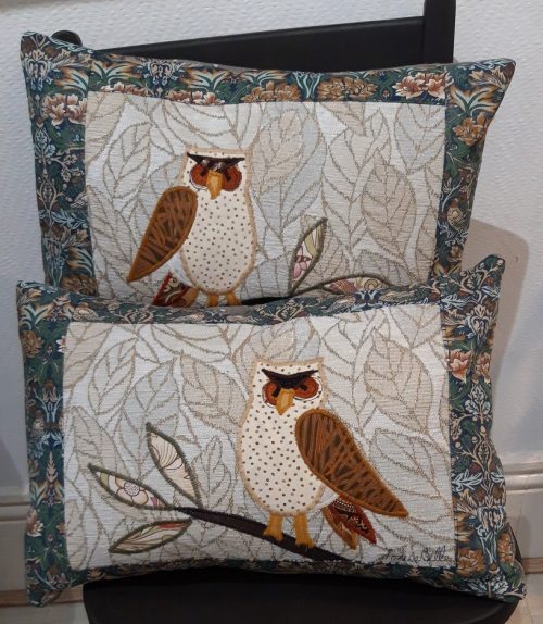 Pair of Owl cushions. Owls on branches, one facing right and one left.